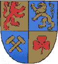 Der rote L�we steht f�r die Grafen von Katzenelnbogen, der goldene L�we f�r die Grafen von Nassau. Hammer und Schl�gel symbolisieren den Bergbau und das rote Kleeblatt die Landwirtschaft.