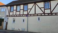 Eckwohnhaus, teilweise Fachwerk, mit Überresten des sogenannten Untertors.