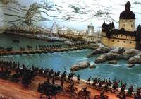 Das Bild zeigt ein Diorama mit Zinnfiguren aus dem Blüchermuseum der Stadt Kaub. Ein Teil der Soldaten hat bereits das Ufer erreicht, während andere noch über die Schiffsbrücke neben der Wasserburg Kaub laufen.