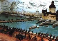 Das Bild zeigt ein Diorama mit Zinnfiguren aus dem Blüchermuseum der Stadt Kaub. Ein Teil der Soldaten hat bereits das Ufer erreicht, während andere noch über die Schiffsbrücke neben der Wasserburg Kaub laufen.
